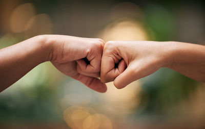 Cropped hand of person holding hands