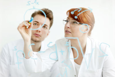 Two scientists working in laboratory