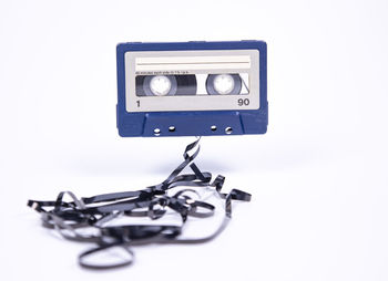 Close-up of telephone booth against white background