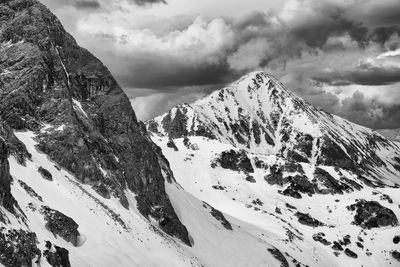 Scenic view of snow covered mountains against sky