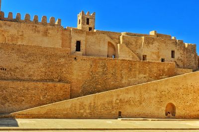 Low angle view of fort against clear sky