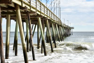 Scenic view of pier over sea against sky