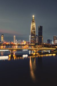 Illuminated buildings in city at night