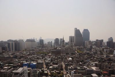 Cityscape against clear sky