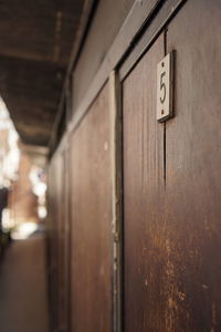 Close-up of text on wall in building