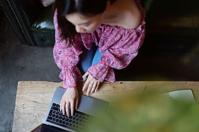 High angle view of girl using mobile phone