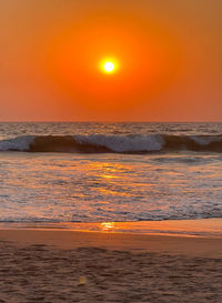Scenic view of beach against sky during sunset
