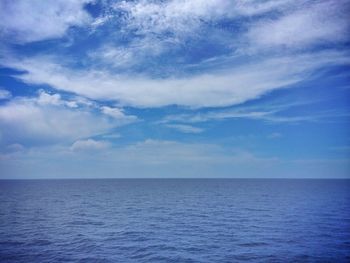 View of calm sea against cloudy sky