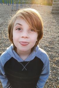 Portrait of smiling boy standing outdoors