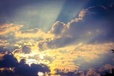 Low angle view of clouds in sky at sunset