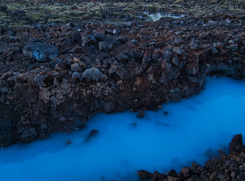 High angle view of river amidst rocks