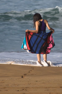 Rear view of woman on beach