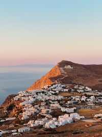 Scenic view of old town against clear sky during sunset