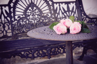 Close-up of pink rose on table