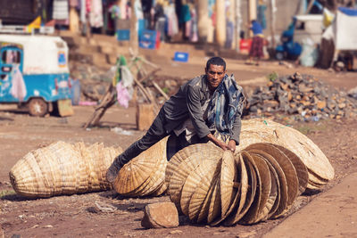 Man working in basket on street