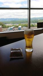 Glass of beer on table