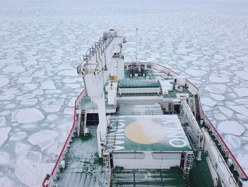 High angle view of an ice breaker ship surrounded by sea ice in the antarctic