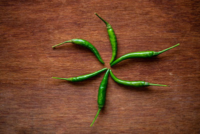 High angle view of green chili pepper on table