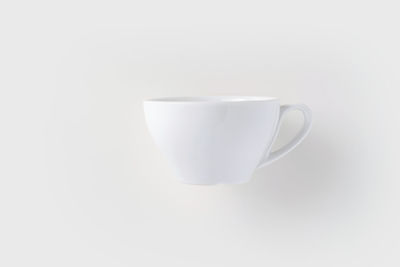 Close-up of coffee cup against white background