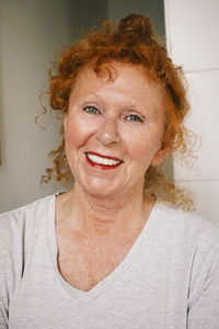 Portrait of smiling senior woman at home