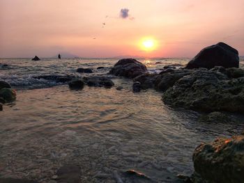 Scenic view of sea against sky during sunset