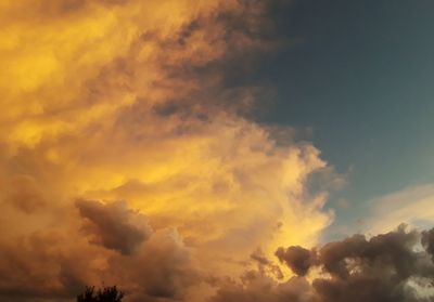 Low angle view of dramatic sky during sunset