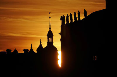 Silhouette temple against sky during sunset
