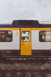 Train at railroad station against sky