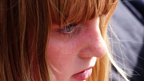 Close-up of young woman looking away