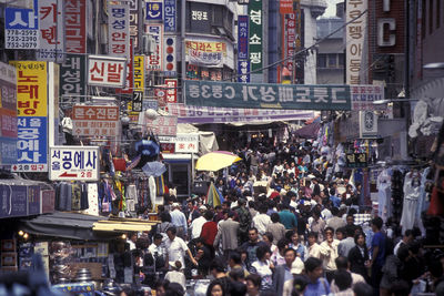 Crowd at market in city