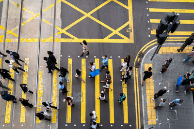 High angle view looking at people crossing the road