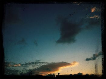 Scenic view of landscape against cloudy sky