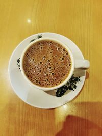 High angle view of coffee cup on table