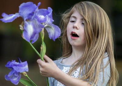 Portrait of woman with pink flowers