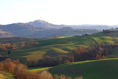 Scenic view of landscape and mountains against sky