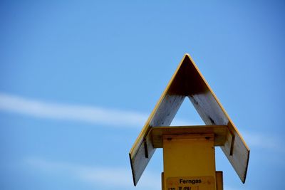 Low angle view of tree against blue sky