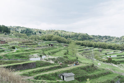 High angle view of agricultural landscape against sky