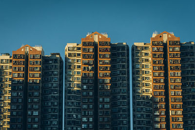 Residential buildings against sky in city
