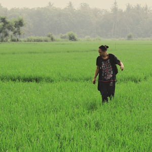 Full length of man standing on field