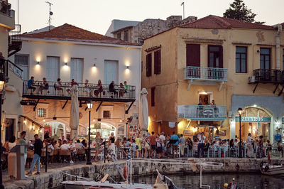 Group of people in illuminated building at night