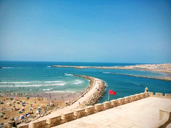 High angle view of swimming pool by sea against clear sky