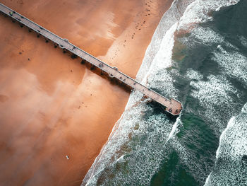 High angle view of skateboard by sea