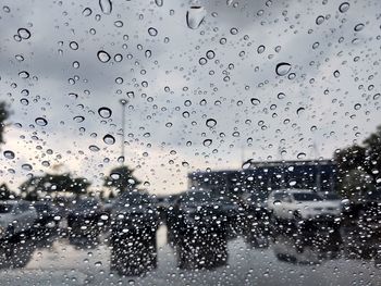 Full frame shot of wet glass window in rainy season