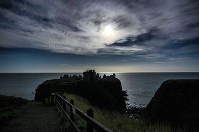 Scenic view of sea against cloudy sky