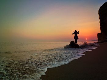 Scenic view of sea at sunset