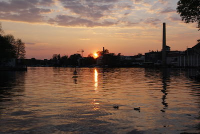 Reflection of clouds in water at sunset