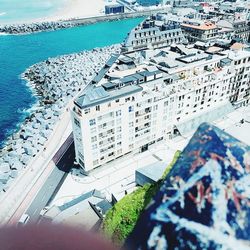 High angle view of cityscape by sea