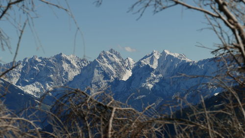 Scenic view of snowcapped mountains against clear sky