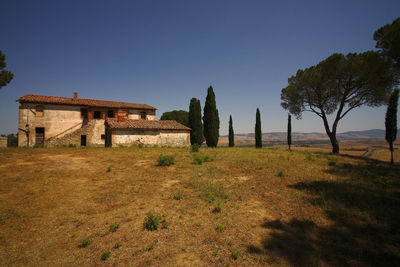 Built structure on landscape against clear sky