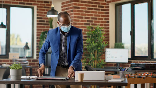 Side view of businessman working at office